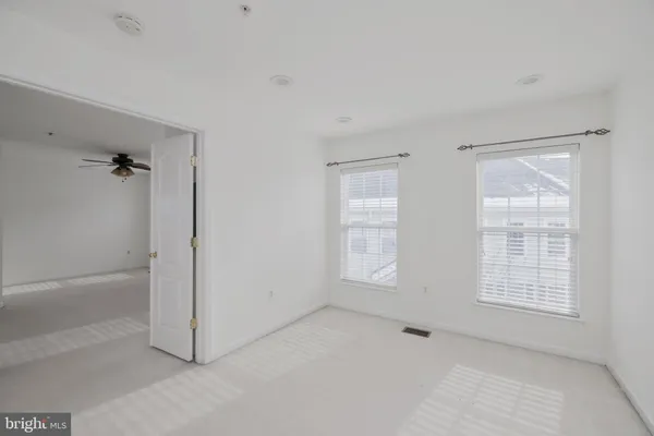 an empty room with windows