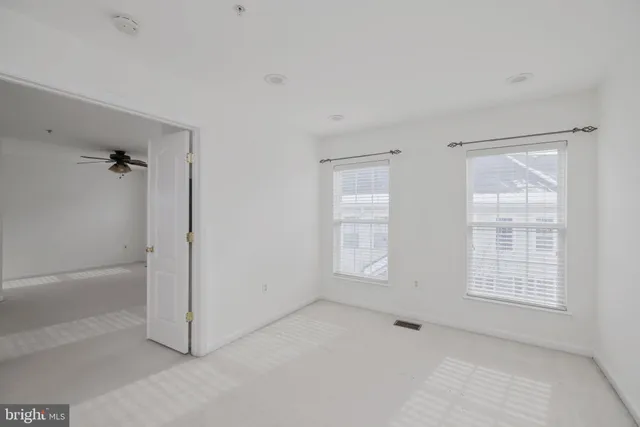 an empty room with windows