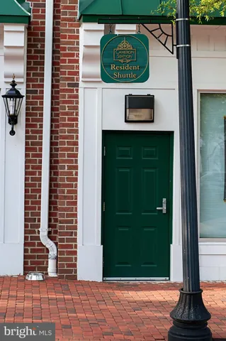 a view of a door with a door and a potted plant
