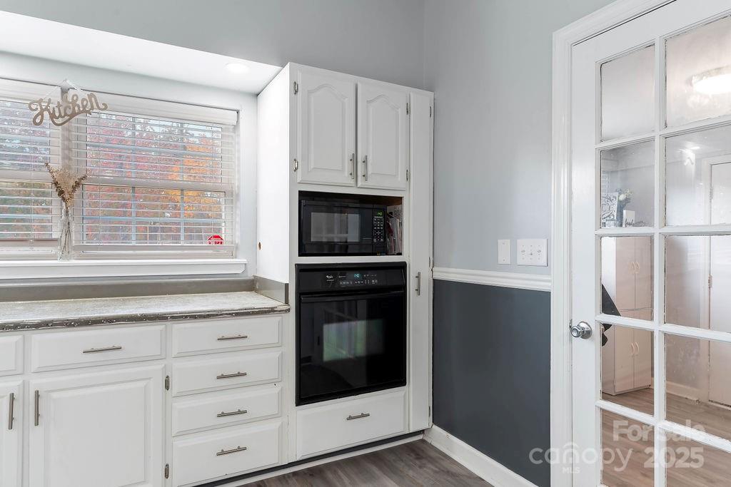 203 Providence Church Road Forest City, NC 28043 - Photo 14 of 46 a kitchen with white cabinets and appliances