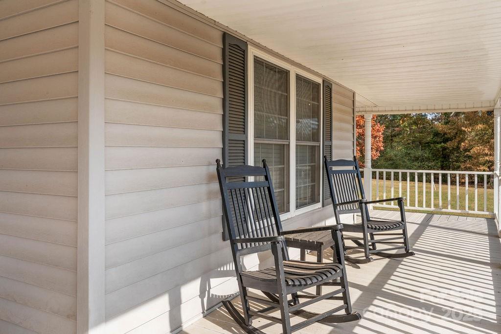 203 Providence Church Road Forest City, NC 28043 - Photo 3 of 46 a view of a balcony with two chairs and a table
