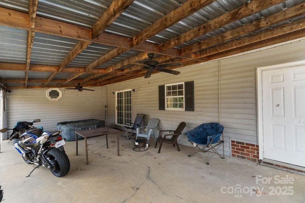 203 Providence Church Road Forest City, NC 28043 - Photo 31 of 46 a backyard of a house with outdoor seating