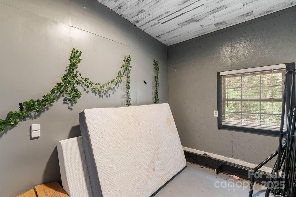 203 Providence Church Road Forest City, NC 28043 - Photo 36 of 46 a view of room with window and wooden floor