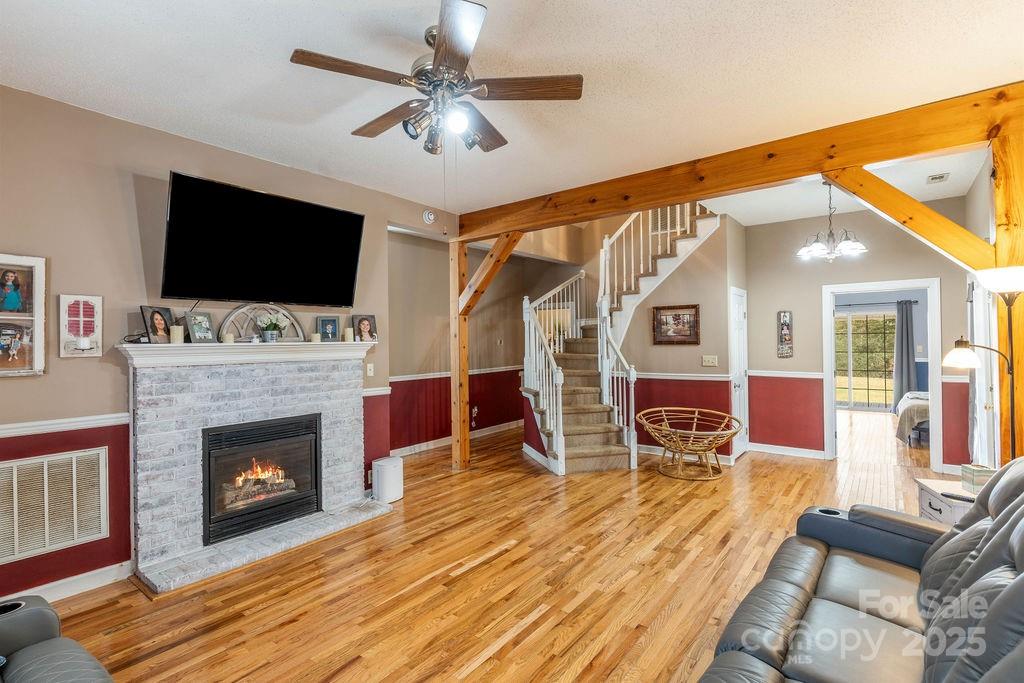 203 Providence Church Road Forest City, NC 28043 - Photo 4 of 46 a living room with furniture a flat screen tv and a fireplace