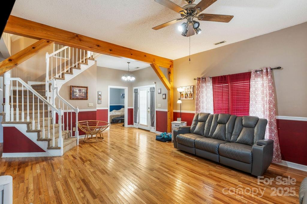 203 Providence Church Road Forest City, NC 28043 - Photo 6 of 46 a living room with furniture or wooden floor and a chandelier