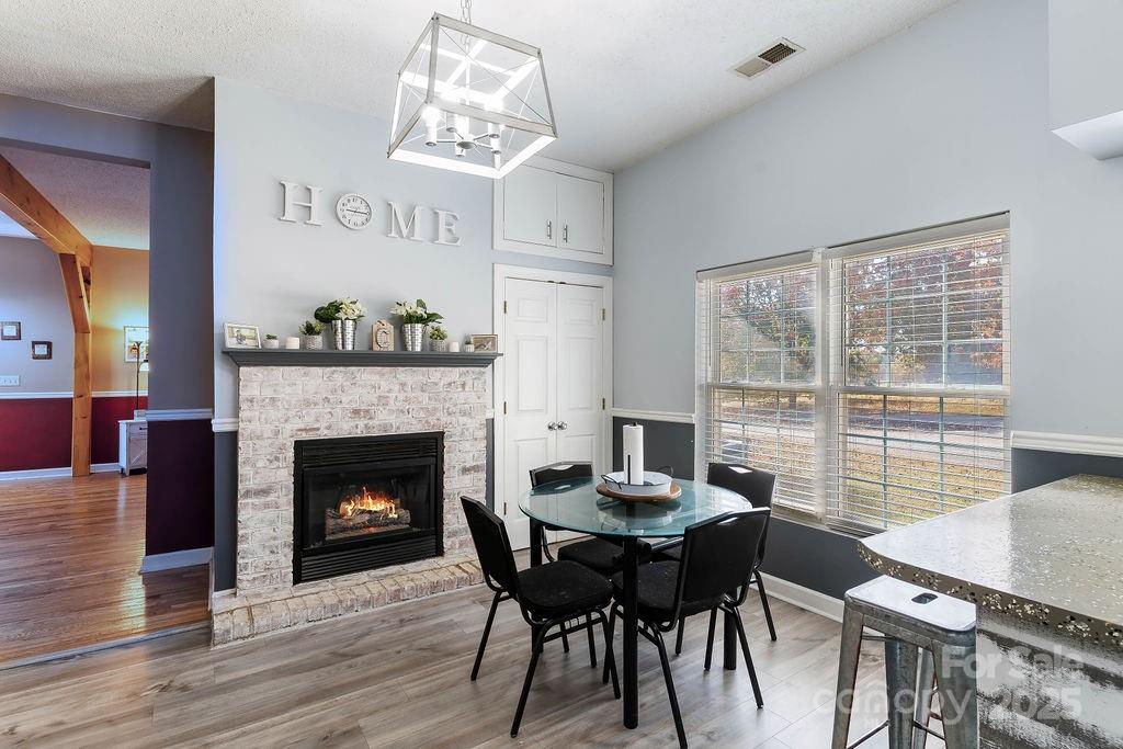 203 Providence Church Road Forest City, NC 28043 - Photo 9 of 46 a view of a dining room with furniture window and wooden floor