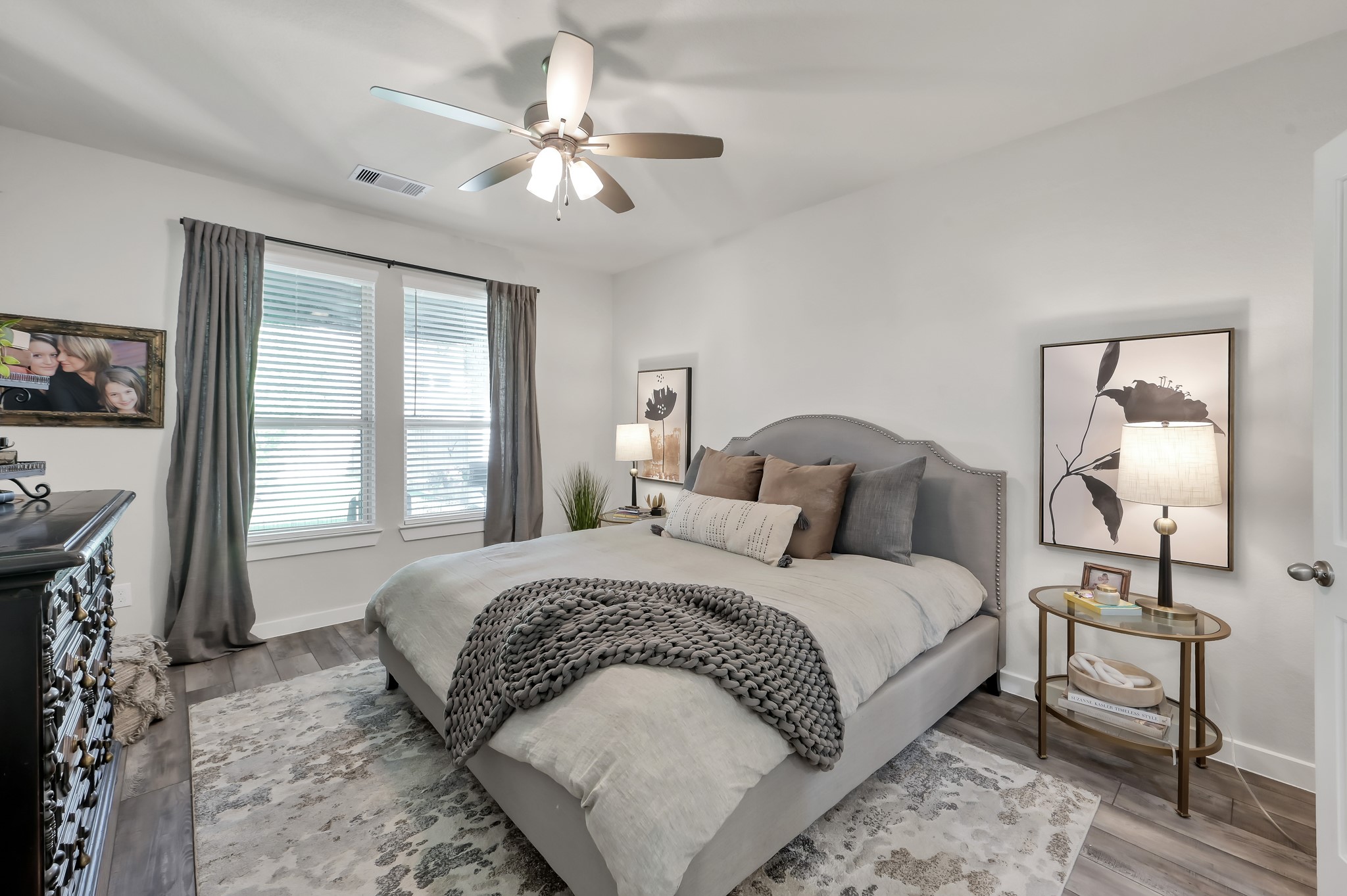 554 Timber Voyage Court Conroe, TX 77304 - Photo 14 of 35 a bedroom with a bed and a chandelier