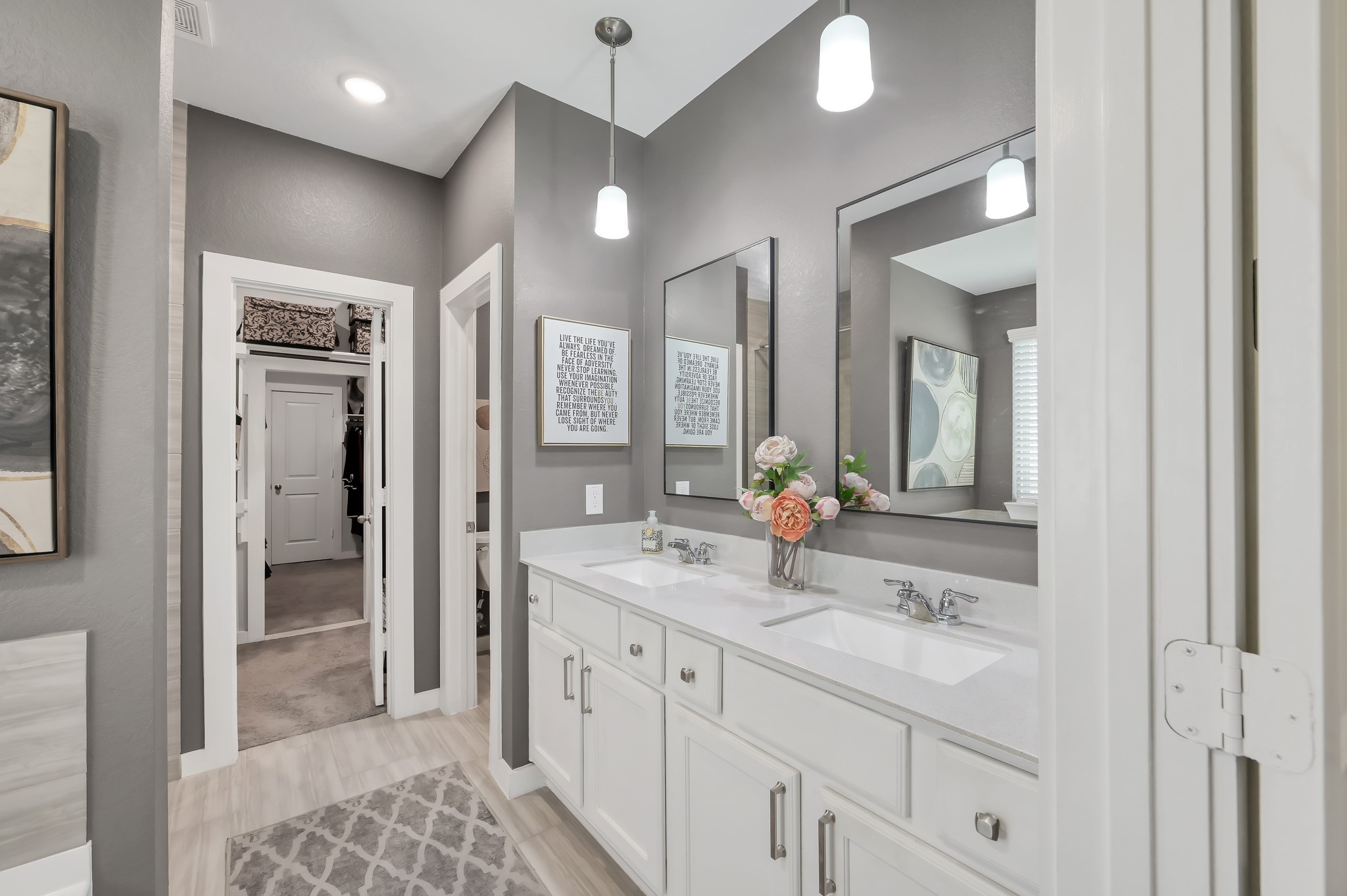 554 Timber Voyage Court Conroe, TX 77304 - Photo 15 of 35 a bathroom with a sink a vanity a mirror and a shower