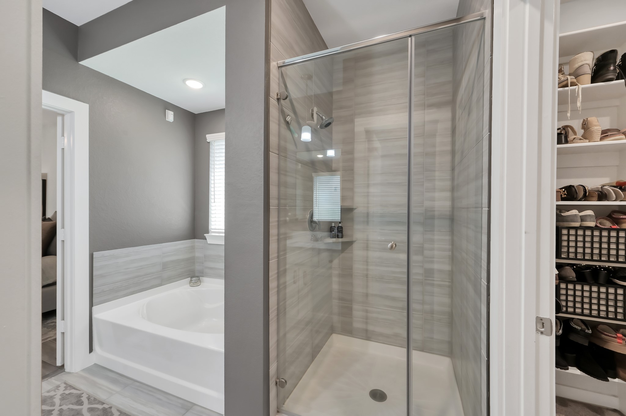 554 Timber Voyage Court Conroe, TX 77304 - Photo 16 of 35 a bathroom with a bathtub and a shower