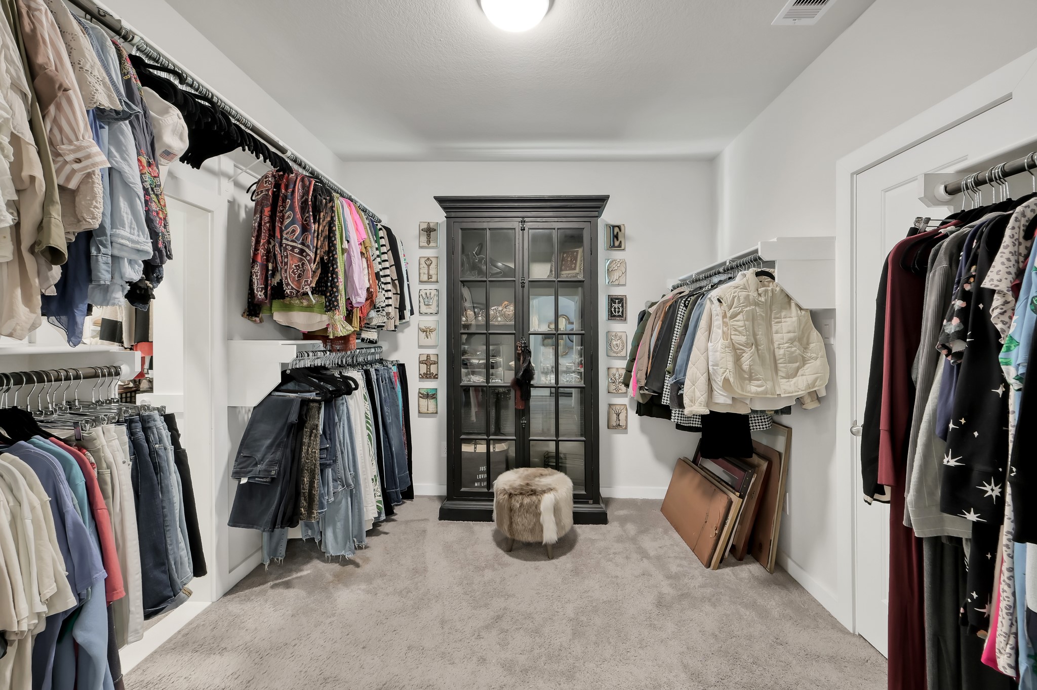 554 Timber Voyage Court Conroe, TX 77304 - Photo 17 of 35 a view of walk in closet with clothes and shoes