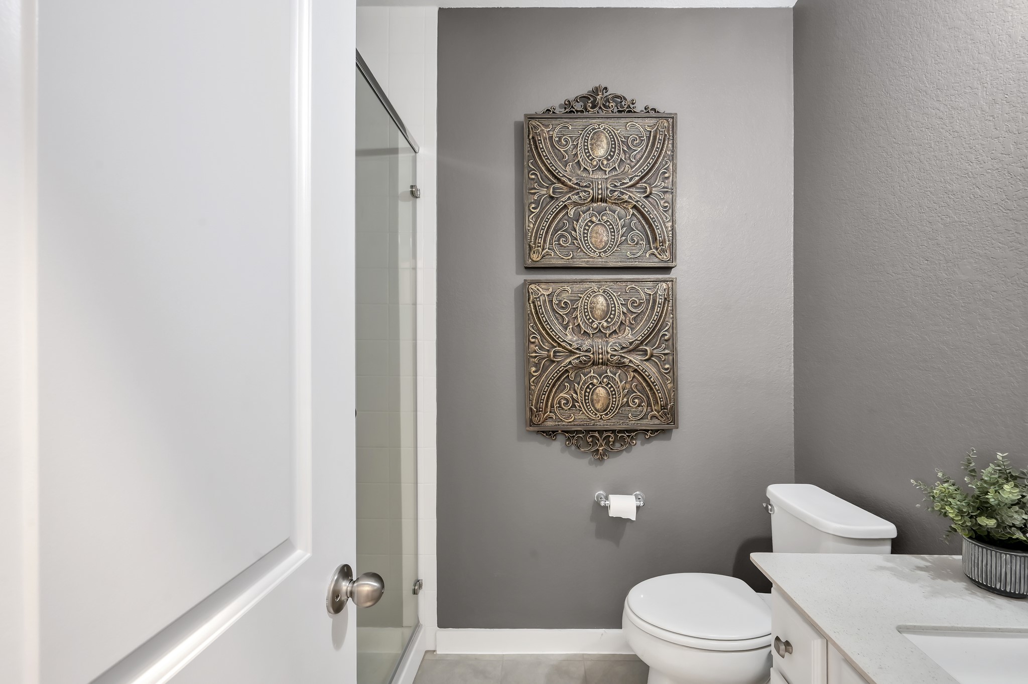 554 Timber Voyage Court Conroe, TX 77304 - Photo 18 of 35 a white toilet sitting next to a bathroom sink