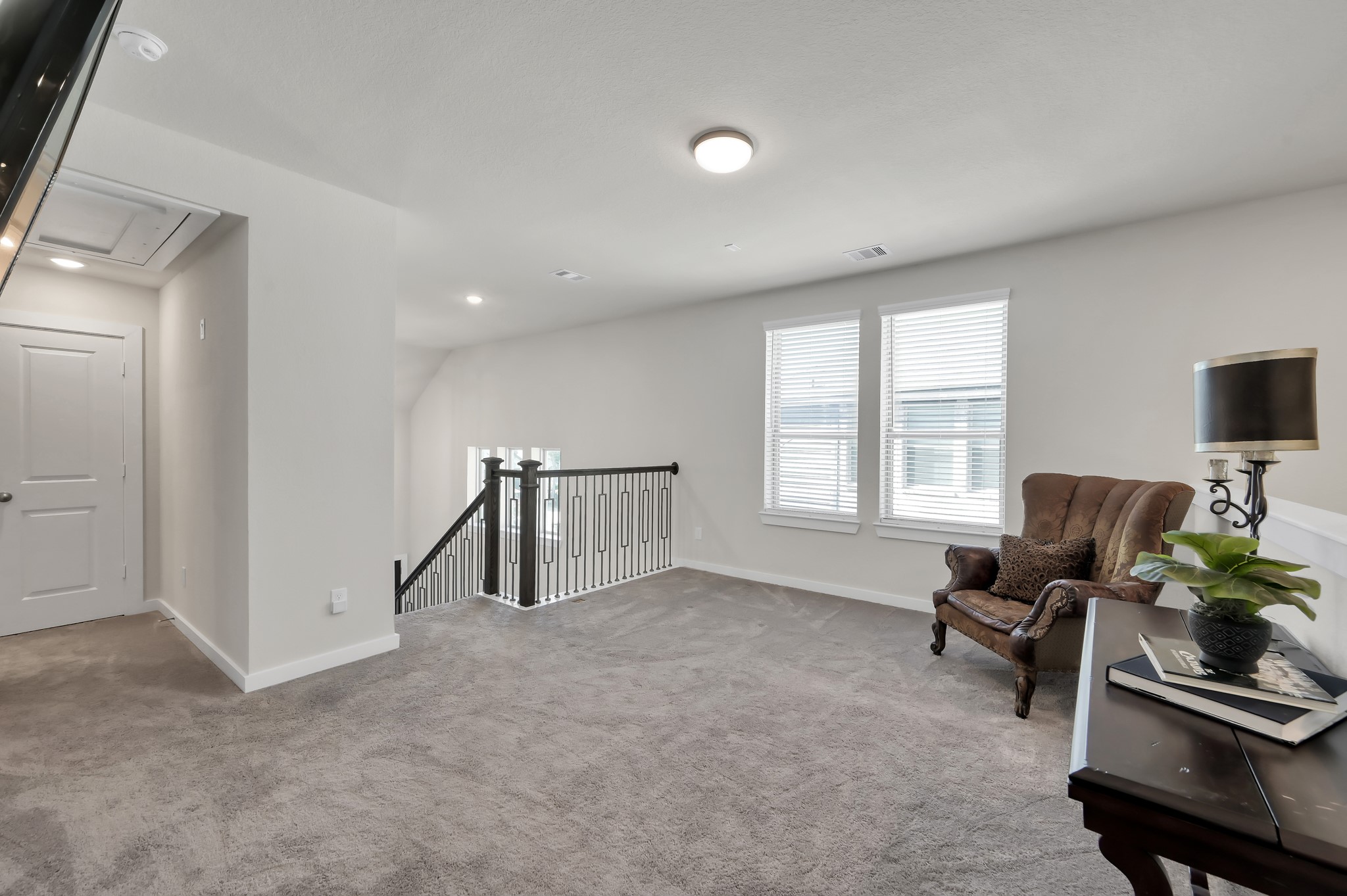 554 Timber Voyage Court Conroe, TX 77304 - Photo 20 of 35 a living room with furniture and a flat screen tv