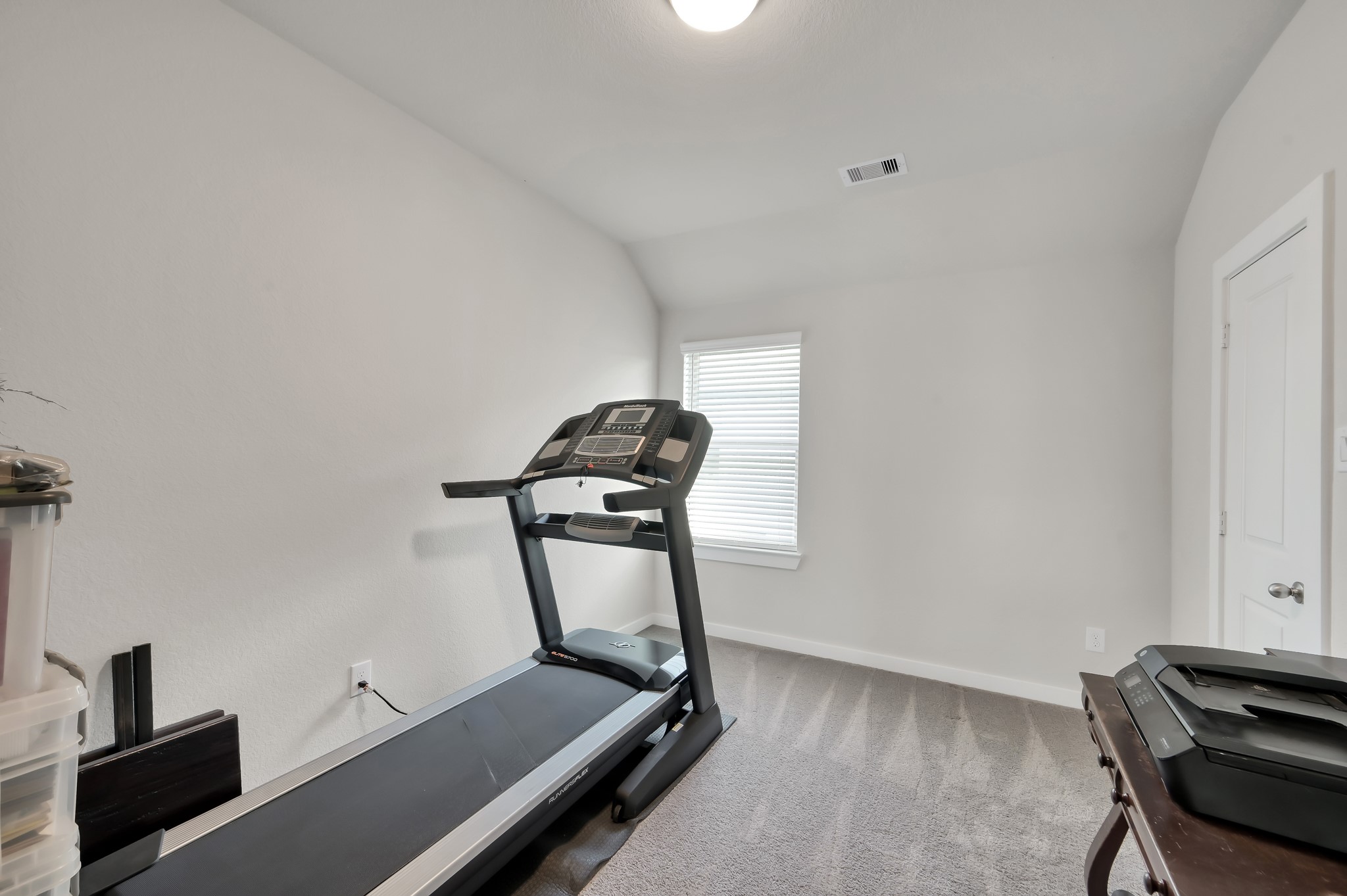 554 Timber Voyage Court Conroe, TX 77304 - Photo 22 of 35 a room with gym equipment