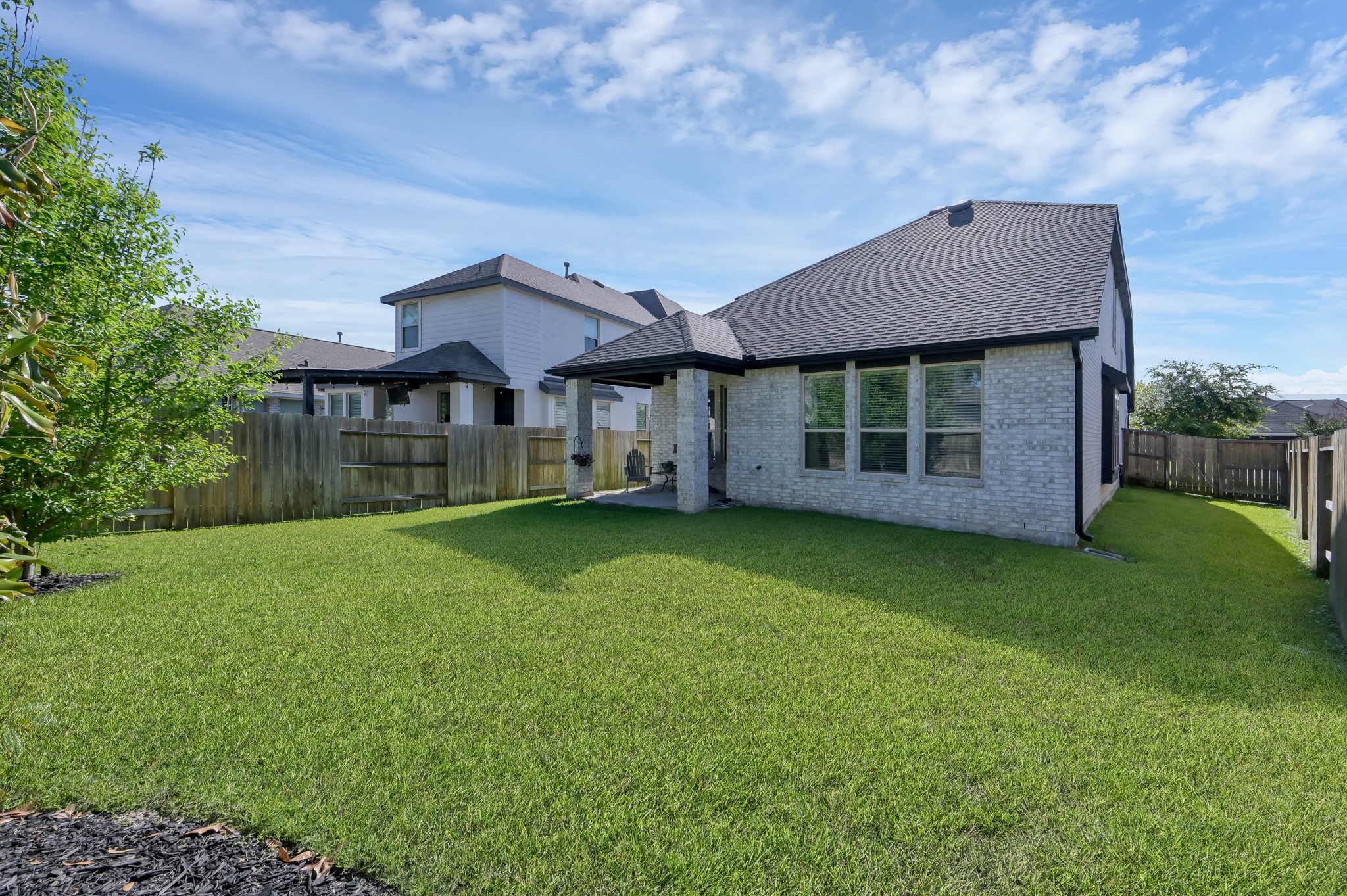 554 Timber Voyage Court Conroe, TX 77304 - Photo 28 of 35 a front view of a house with a garden