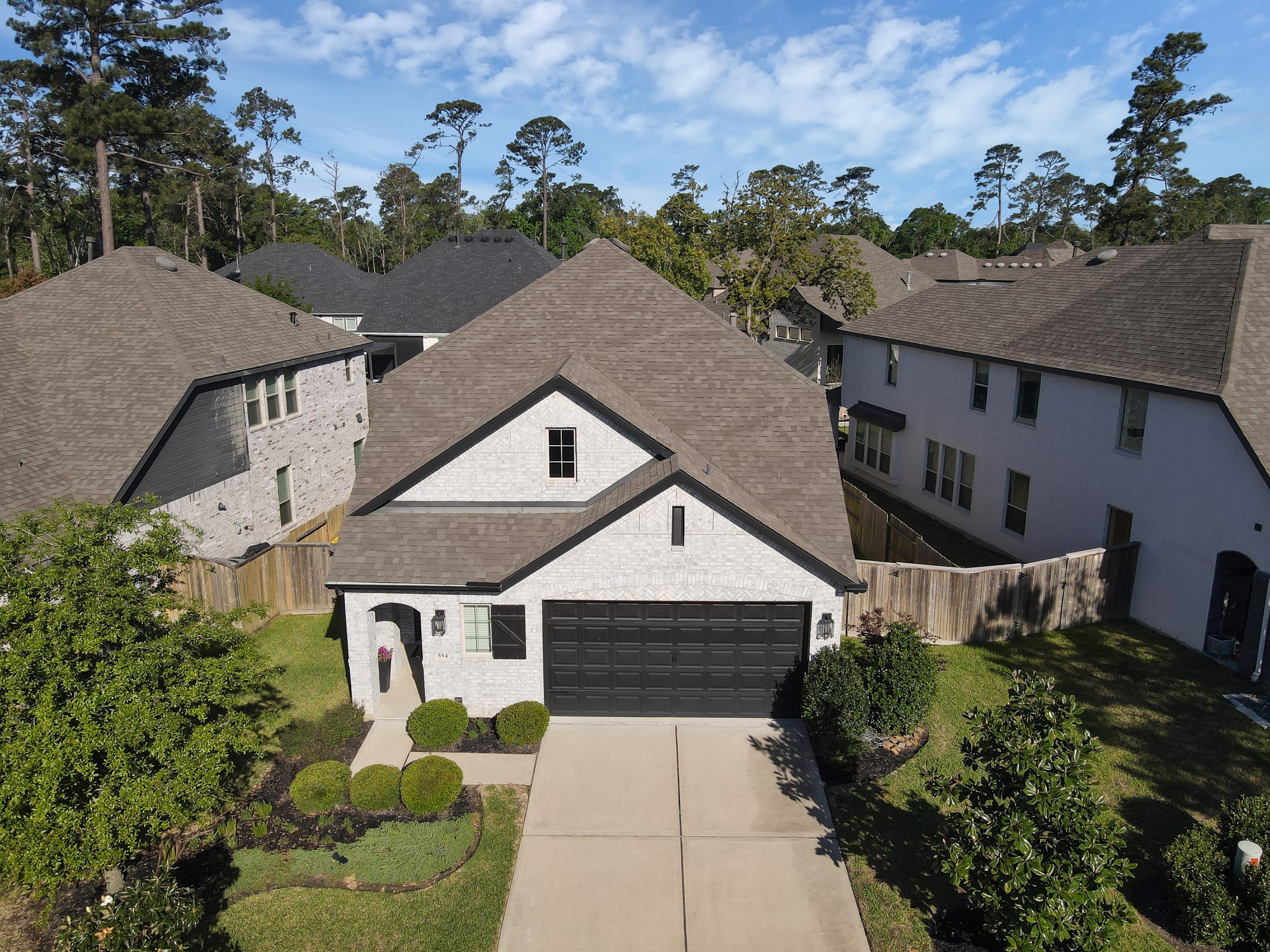 554 Timber Voyage Court Conroe, TX 77304 - Photo 2 of 35 a aerial view of a house with a yard