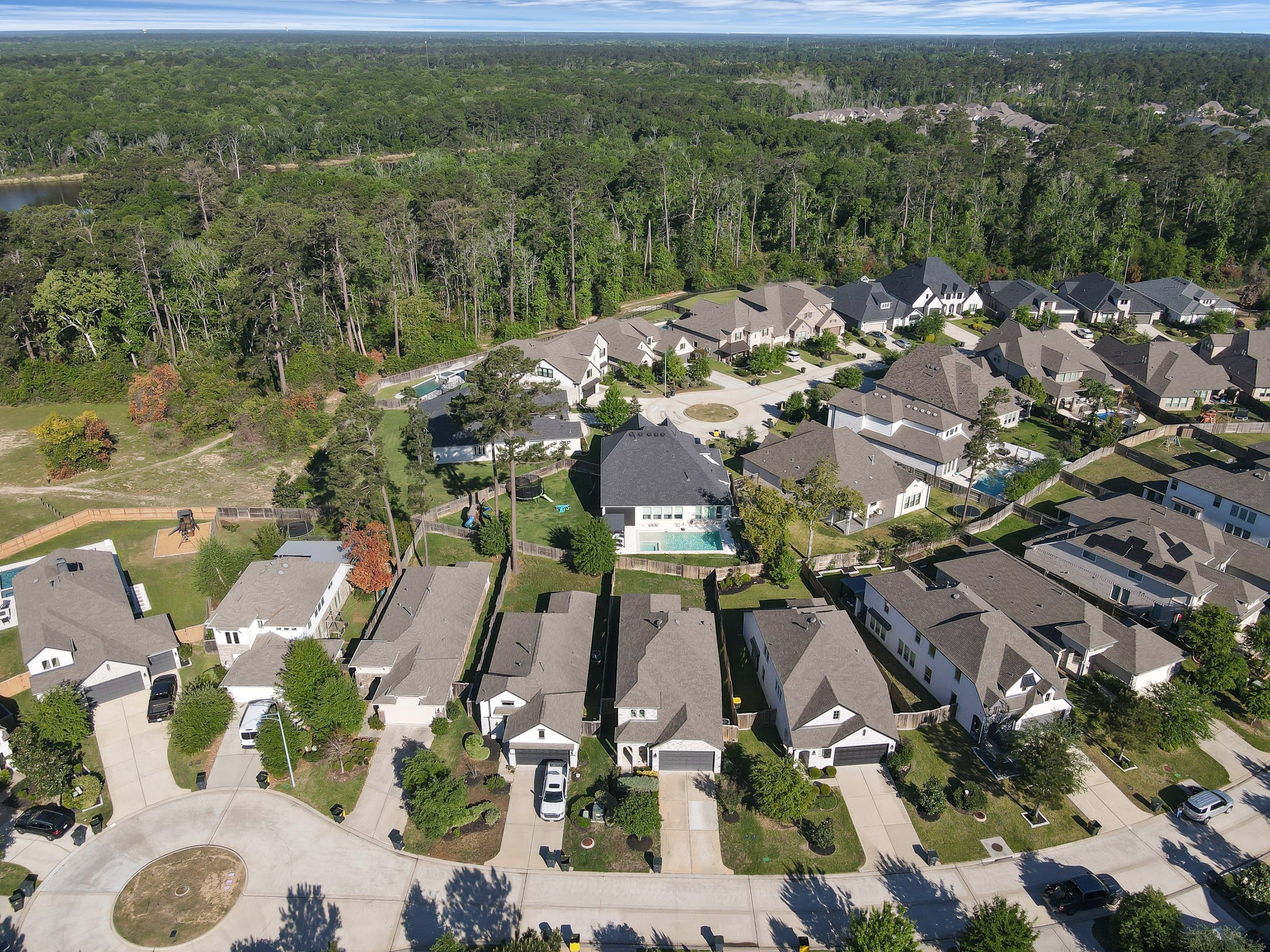 554 Timber Voyage Court Conroe, TX 77304 - Photo 31 of 35 an aerial view of residential houses with outdoor space