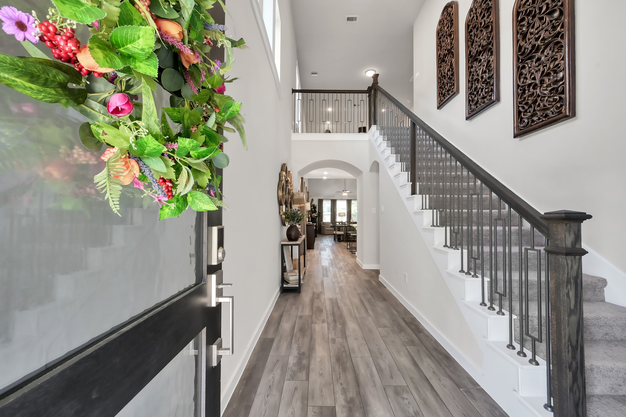 554 Timber Voyage Court Conroe, TX 77304 - Photo 4 of 35 a view of entryway with wooden floor