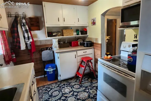 a room with furniture a flat screen tv and a fireplace