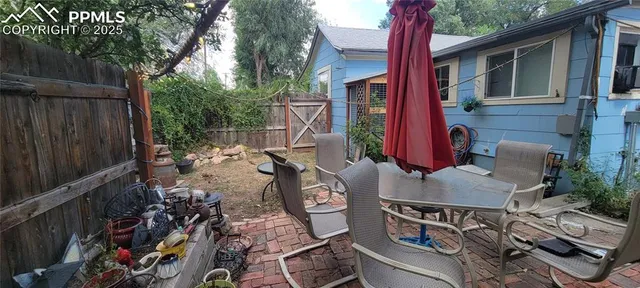 a view of yard with patio