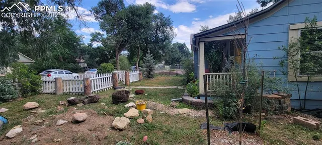 a backyard of a house with lots of green space