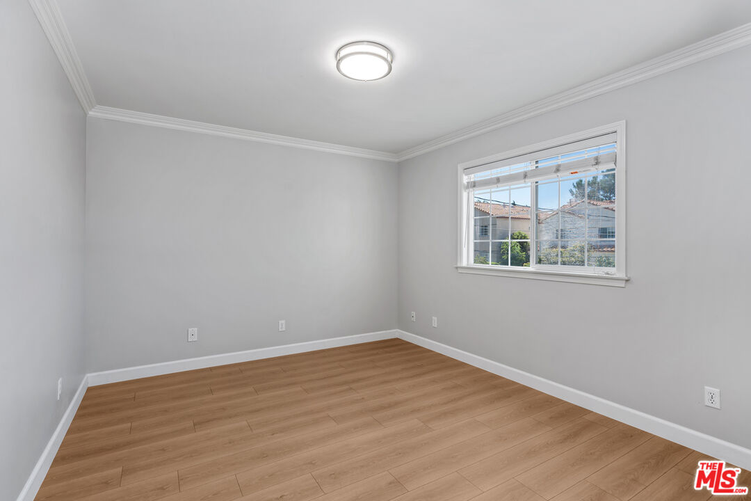 2409 Olive Avenue La Crescenta, CA 91214 - Photo 16 of 25 a view of an empty room with wooden floor and a window