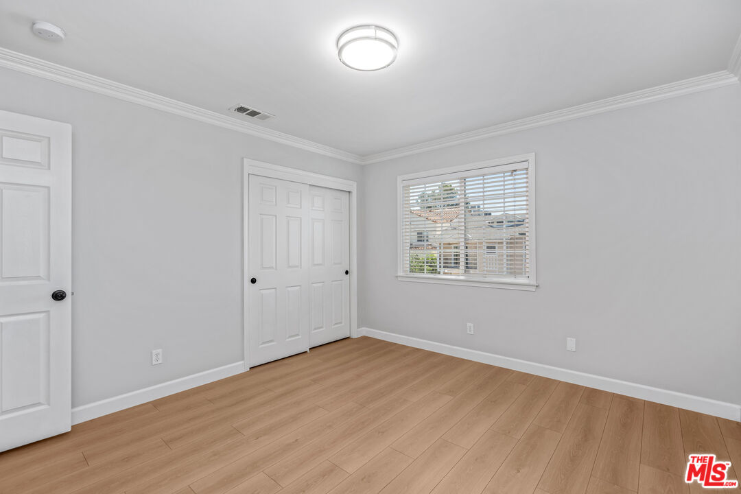 2409 Olive Avenue La Crescenta, CA 91214 - Photo 17 of 25 a view of an empty room with wooden floor and a window