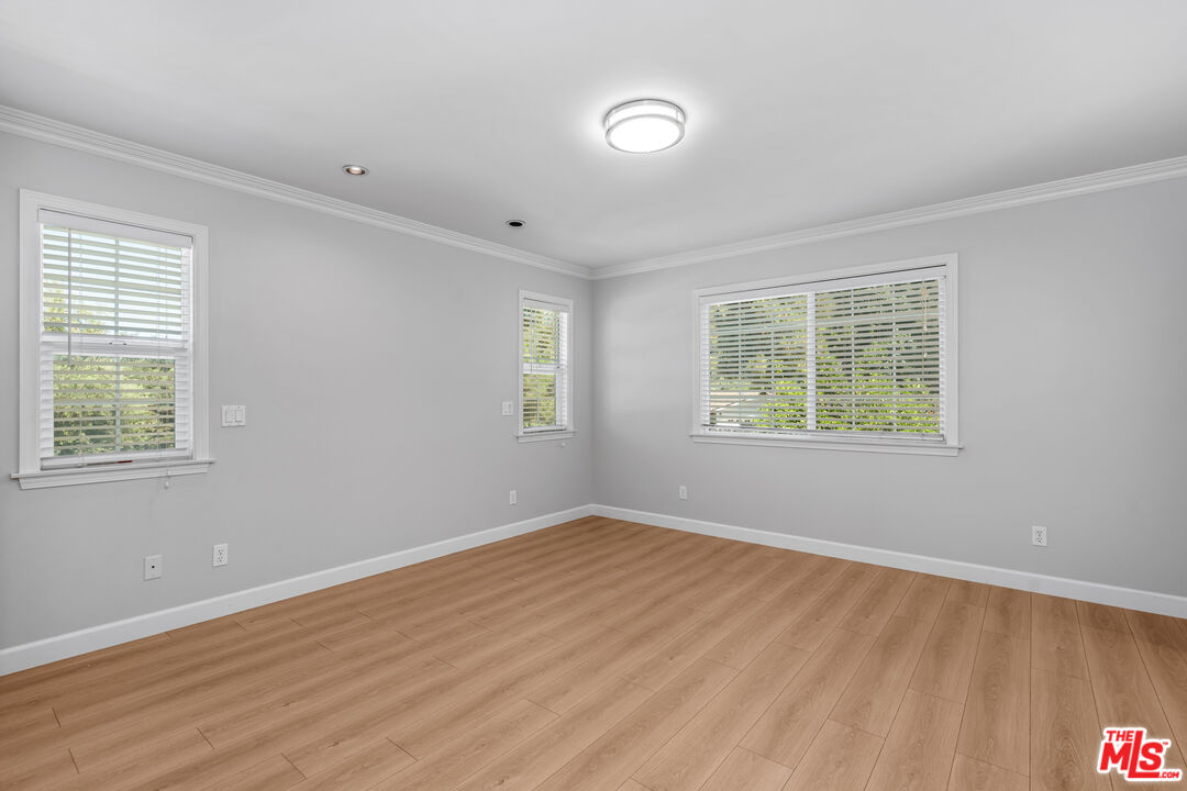 2409 Olive Avenue La Crescenta, CA 91214 - Photo 20 of 25 an empty room with wooden floor and windows