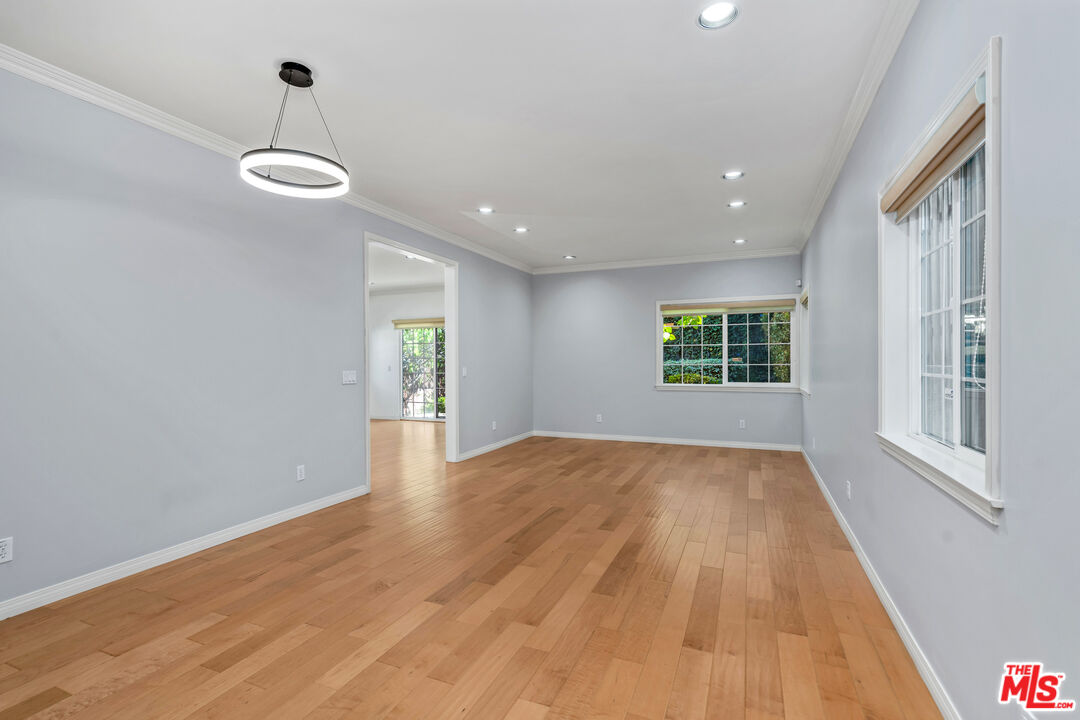 2409 Olive Avenue La Crescenta, CA 91214 - Photo 2 of 25 a view of an empty room with wooden floor and a window