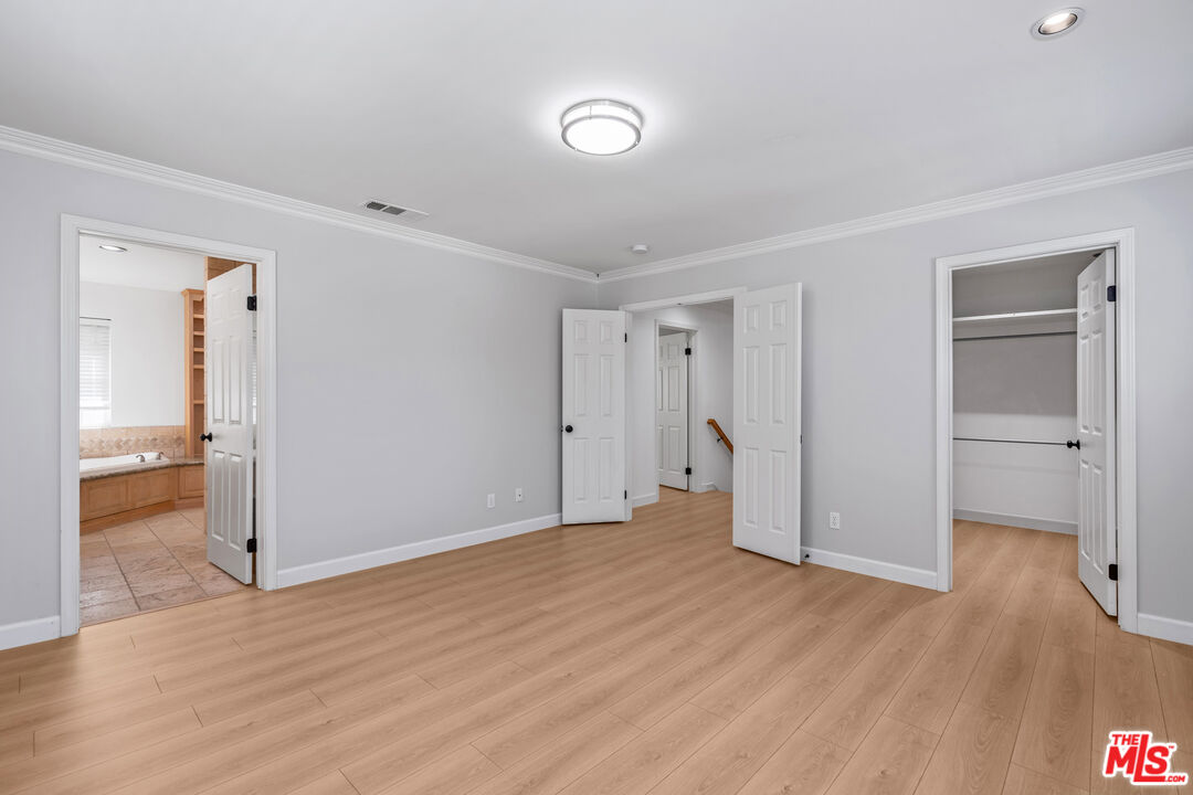2409 Olive Avenue La Crescenta, CA 91214 - Photo 22 of 25 a view of an empty room with wooden floor and a bathroom