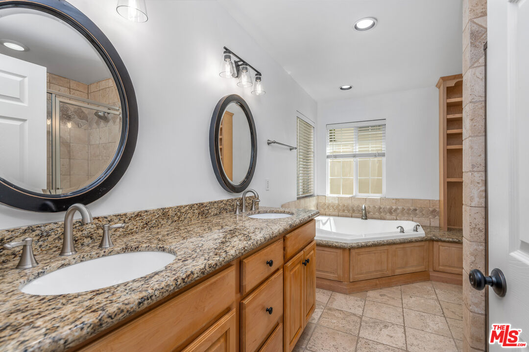 2409 Olive Avenue La Crescenta, CA 91214 - Photo 24 of 25 a bathroom with a granite countertop sink and a mirror