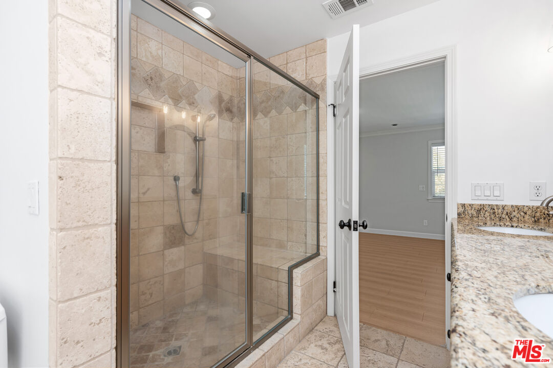 2409 Olive Avenue La Crescenta, CA 91214 - Photo 25 of 25 a bathroom with a glass shower door