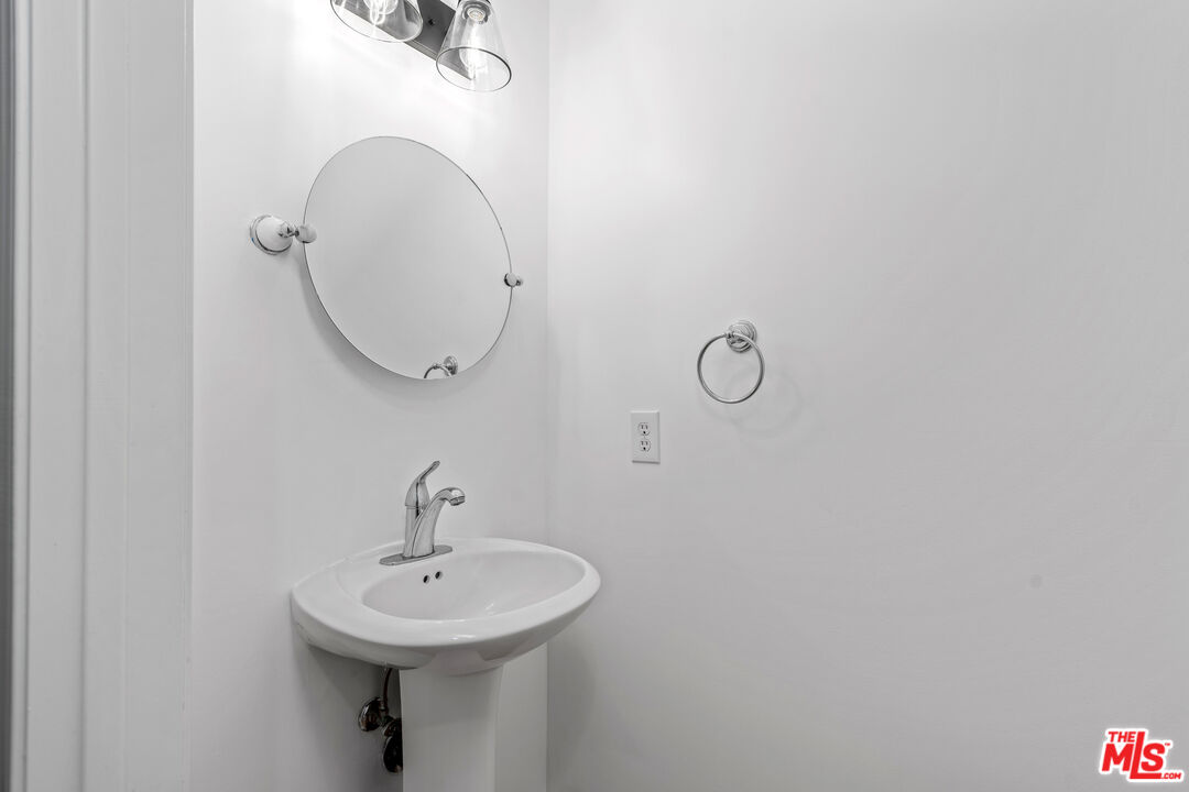 2409 Olive Avenue La Crescenta, CA 91214 - Photo 4 of 25 a bathroom with a sink and mirror