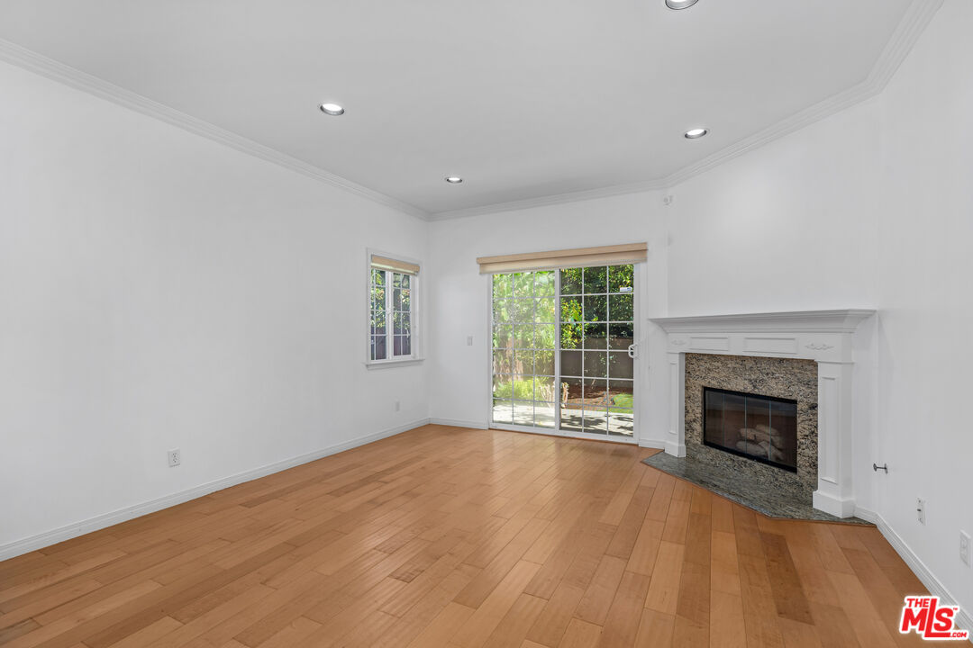 2409 Olive Avenue La Crescenta, CA 91214 - Photo 5 of 25 a view of an empty room with a fireplace and a window