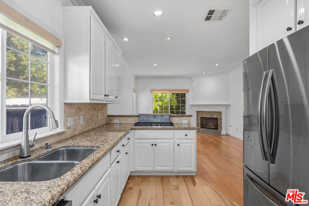 2409 Olive Avenue La Crescenta, CA 91214 - Photo 9 of 25 a kitchen with granite countertop a sink stove and refrigerator