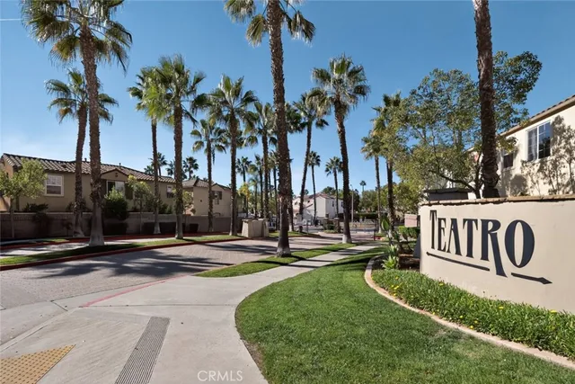 a sign board with palm trees