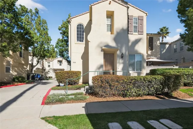 a front view of a house with yard