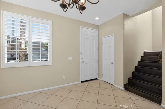a view of entryway with stairs and wooden floor