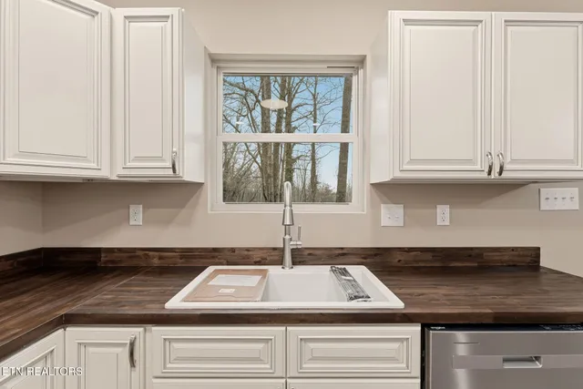 a kitchen with appliances cabinets and a counter top space