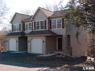 2248 Hillside Road, Unit 1 Slatington, PA 18080 - Photo 1 of 1 a front view of a house with a yard