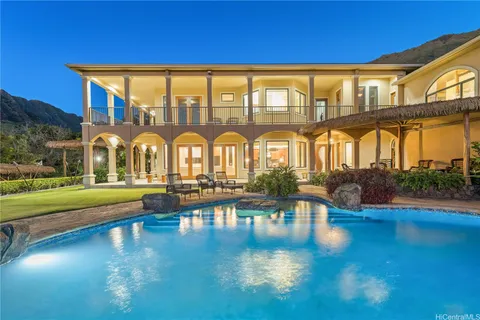 a view of a swimming pool with a table and chairs