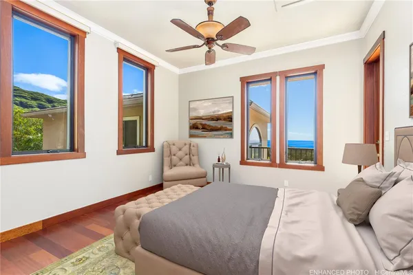 a bedroom with a large bed and a large window