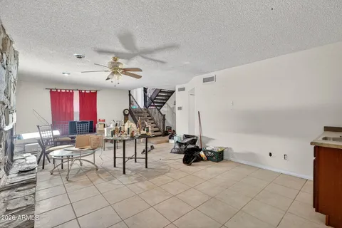 a view of a livingroom with furniture and a window