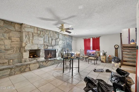 a living room with fireplace furniture and a flat screen tv