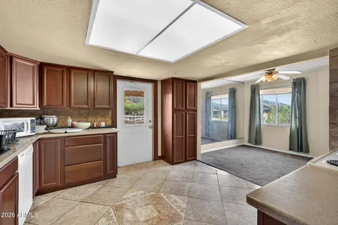 a kitchen with refrigerator and cabinets