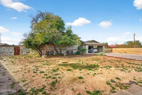a house with yard in front of it