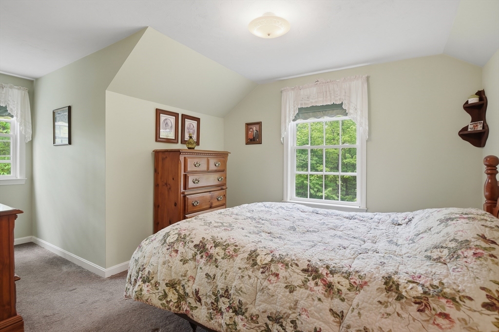 186 Common Street Groton, MA 01450 - Photo 20 of 28 a bedroom with a bed and a window