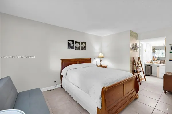 a bed room with a bed and furniture