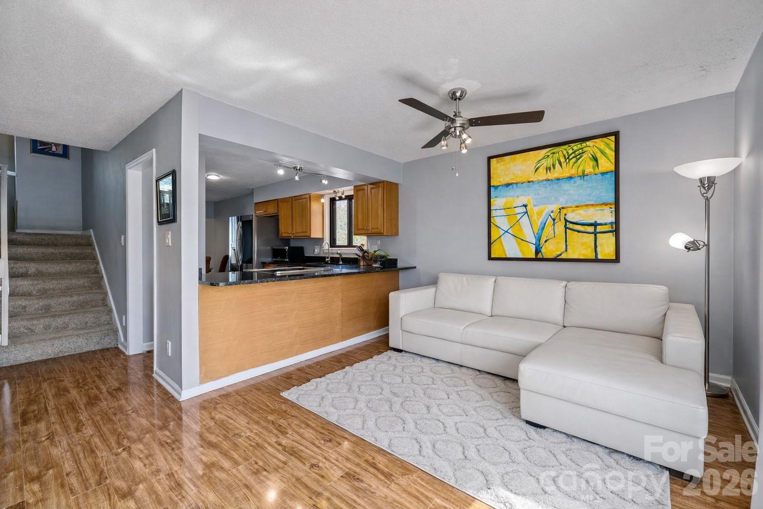 9067 Tulagi Court Fort Mill, SC 29708 - Photo 14 of 44 a living room with furniture and kitchen view
