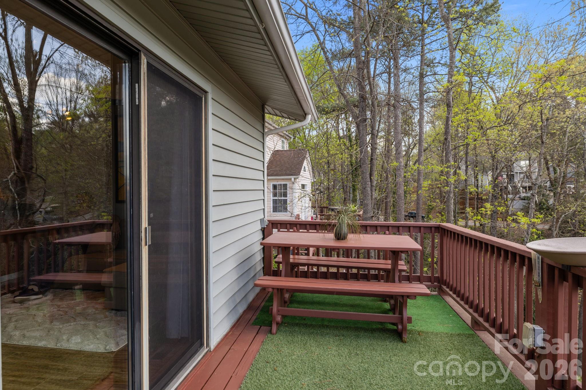 9067 Tulagi Court Fort Mill, SC 29708 - Photo 16 of 44 a view of a deck with wooden floor and outdoor seating