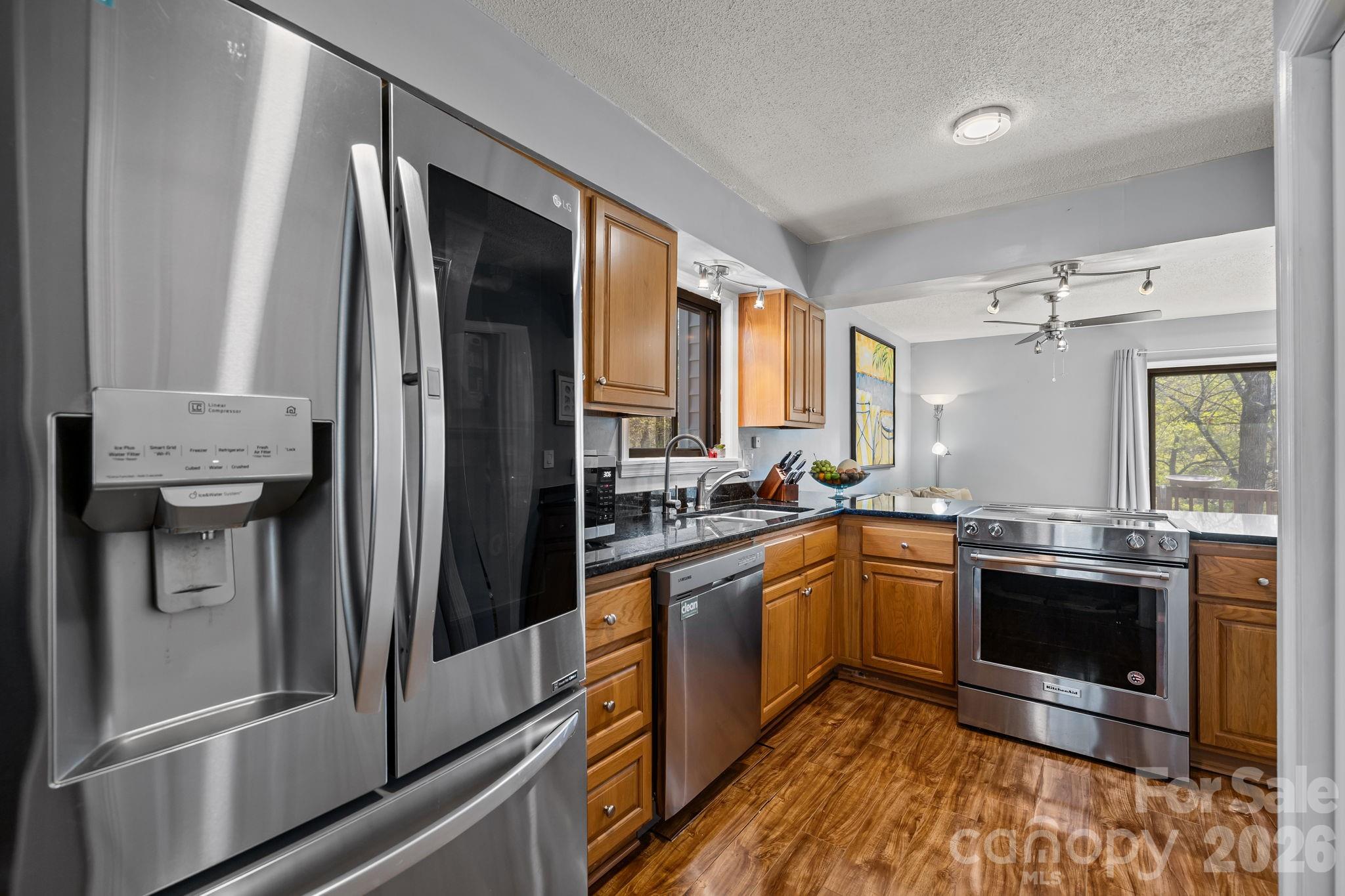 9067 Tulagi Court Fort Mill, SC 29708 - Photo 20 of 44 a kitchen with stainless steel appliances granite countertop a refrigerator and a sink